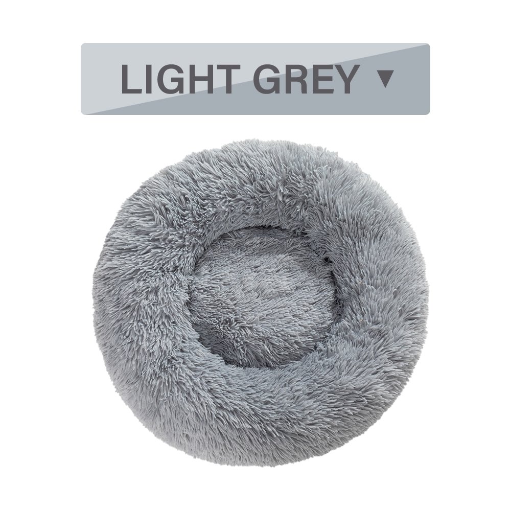 Light grey calming donut dog bed, top view